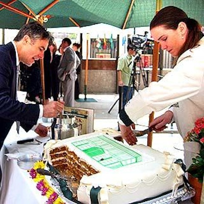 Representatives from Smith & Wollensky hustled to meet the public's demand for slices of their carrot cake.