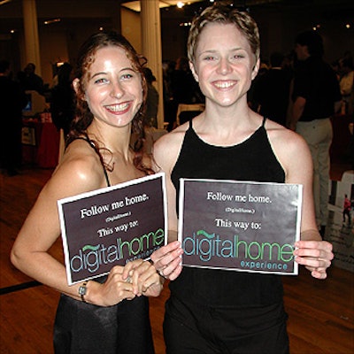 Amanda Kay (left) and Kadee Jacobsen were hired by event organizers PepCom Inc. to lead attendees from the main space of the Metropolitan Pavilion to the hidden fourth floor, which housed the DigitalHome Experience portion of the exhibits.