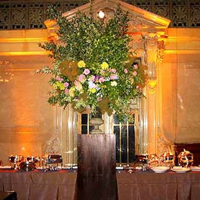 Tansey Design Associates created large flower arrangements that stood over Glorious Food's buffet stations.