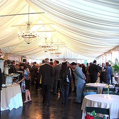 Guests mingled in the tented cocktail area before dinner in the ballroom.