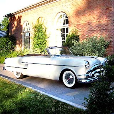 A shiny 1952 Packard was parked outside of the garden to represent an Edelman client from the year the firm was founded.