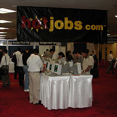Rows of computers helped job seekers register for the HotJobs.com Career Expo. The banners were printed by Esco Stationery.