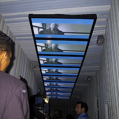 Overhead plasma monitors showing IBM advertising images lined the entrance at Spa.