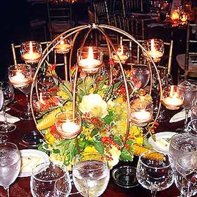 Globe-shaped votive candelabra centerpieces by Douglas Koch Visuals created a warm look for the tables.