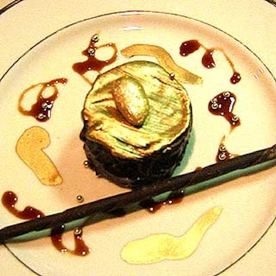 The Upper Crust's gold-painted gianduja cakes topped with ganache and almonds were served for dessert.