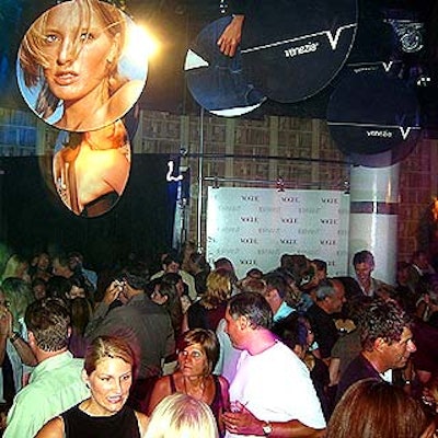 V-Jeans ads hung from the ceiling over a crowd of mostly young professionals.