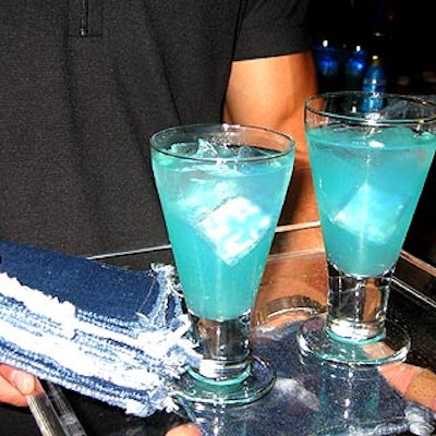 Olivier Cheng Catering and Events served a special blue drink—ginger-infused lemonade spiked with vodka—with denim cocktail napkins from Ruth Fischl.