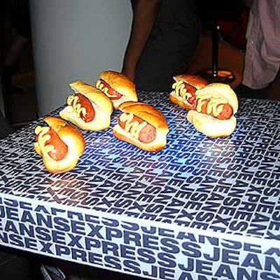 Mini hot dogs arrived on Lucite trays branded with the Express Jeans logo.