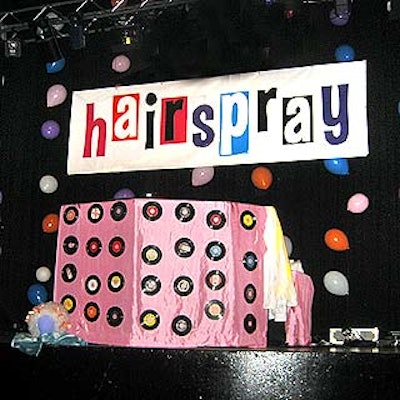 At Hairspray's opening night party, event producer Suzanne Tobak and designer Susan Edgar decorated the walls and a DJ booth onstage with pink cloth and 45 records.