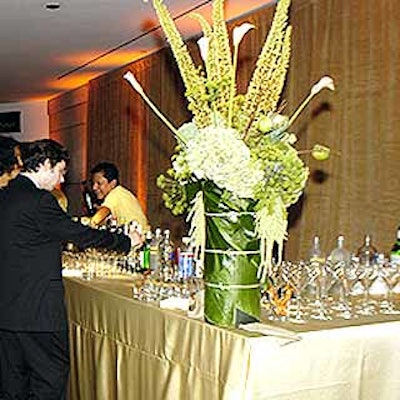 Field used green hydrangea and orchids in his flower arrangements.