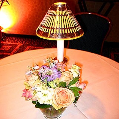 Small cocktail tables were decorated with small lamps and pastel-colored flower arrangements by Oppizzi Designs.