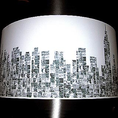 The custom-made lampshades used small black and white photographs of children—the beneficiaries of the nonprofit's work—to create a silhouette of New York's changed skyline.