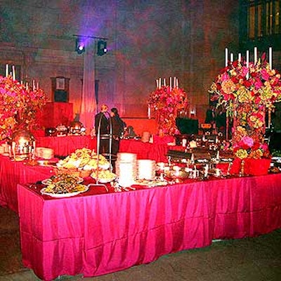 The buffet table was laden with food by Creative Edge Parties and four large flower arrangements by Preston Bailey.