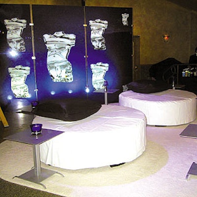 Inside the Hammerstein Ballroom guests lounged in the bar area on giant, white circular ottomans with black throw pillows on white rugs while backlit, glass-paneled screens showed the magazine's silver award.