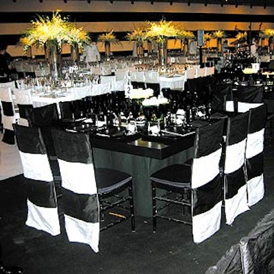 At the Whitney Museum of American Art's Black, White & Whitney fall gala, event designer Colin Cowie created a two-toned dining area with white and black furniture, place settings and wall coverings.