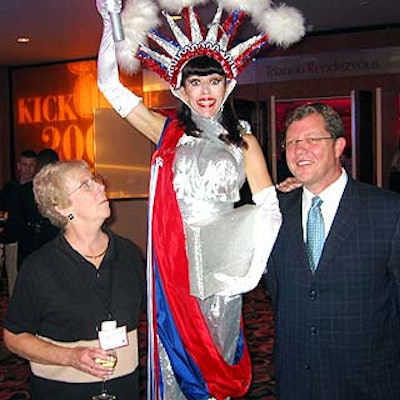 Scitor Corporation's Lee Scott posed with a performer posing as the Statue of Liberty and PRA Destination Management's Patrick Sullivan, who put together Virginia-based Scitor's employee incentive trip to New York.
