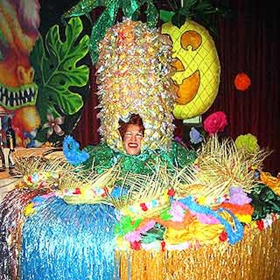 A Bette Midler look-alike inside a table chided costume-less guests to don a hat or silvery grass skirt.