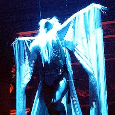 Members of the acrobatic group Antigravity draped in long white cloths performed throughout the night at Heidi Klum's Halloween party at Capitale.