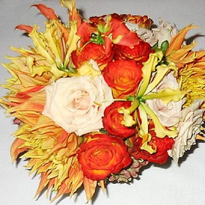 Michael Gonzalez Designs created small floral bouquets in fall colors for the tables.