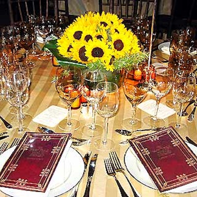 At the New York Public Library's Library Lions benefit in the main library on Fifth Avenue, L'Olivier Floral Atelier decorated tables with bunches of sunflowers in squat green vases.
