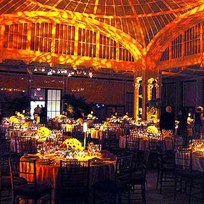 Guests dined in the Celeste Bartos Forum, where Frost Lighting cast an amber light.