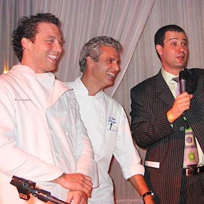 At the live auction portion of the benefit, auctioneer Nicholas Lowry (right) of Swann Galleries auctioned off a dinner party with chefs Rocco DiSpirito (left) of Union Pacific and Eric Ripert of Le Bernardin.