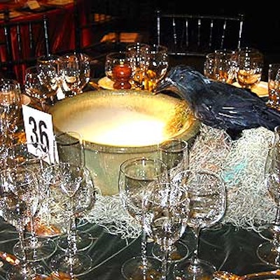 At the Central Park Conservancy's A Spellbinding Night Halloweeen ball in Central Park, black ravens perched on smoking cauldrons in the middle of some banquet tables.