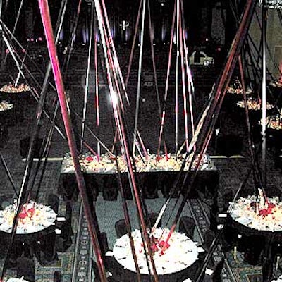 At the New York City Hotel and Motel Association's International Hospitality Ball, Atlas Floral Decorators decorated the Marriott Marquis' Broadway Ballroom with crisscrossing ribbons that reached from the tables to the ceiling.