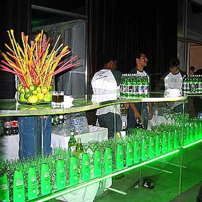 Rows of Fructis bottles lined clear bars with strips of glowing green lights.
