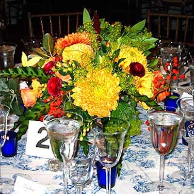 Floral centerpieces in autumnal hues from Gotham Gardens decorated the tables.