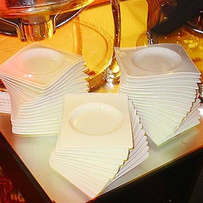 At the New York Restoration Society's annual Hulaween benefit at the Marriott Marquis, square plates with round cut-outs were decoratively stacked at the buffet table.