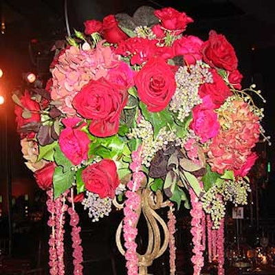 Tansey's centerpieces incorporated blood-red Black Magic roses, Dutch hydrangeas, spray roses, celosias feathers and amaranths.