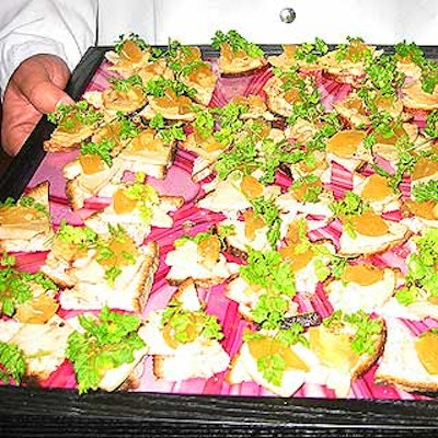 Guastavino's served foie gras on country bread with pear and pepper jelly on trays lined with the pink and white swirl pattern used in the decor.