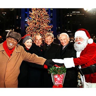 At Rockefeller Center's annual tree lighting, Today co-hosts Al Roker and Ann Curry, Mayor Michael Bloomberg, Rock Center co-owner Jerry Speyer, former astronaut Buzz Aldrin and Santa Claus were on hand to flip the switch on the 30,000 lights decorating the tree. (Photo by Joe Vericker/PhotoBureau Inc.)