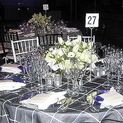 The Met's Chris Giftos created a black-and-white dining area with plaid tablecloths accented with silver dinnerware.