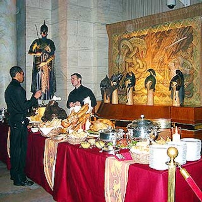 Planners flew in props from the film set in New Zealand to decorate the event. Helmets and suit of armor decorated the rear of the buffet tables.