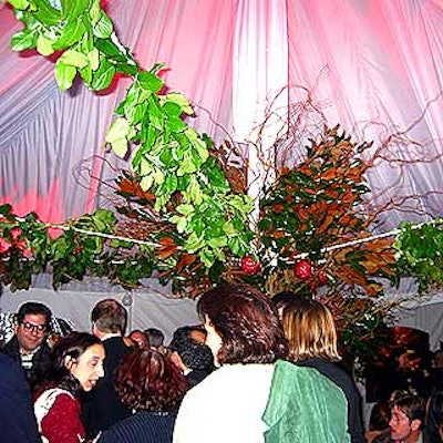 Ropes wrapped with magnolia, mountain laurel and cedar leaves converged in the center of the tented area of Cafe St. Bart's.