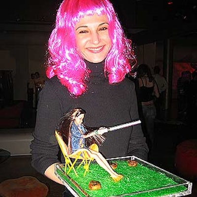 Caterwaiter Ana Milivojevic from Olivier Cheng Catering & Events served hors d'oeuvres on Lucite trays decorated with fake grass and Barbie dolls.