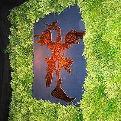 Bill Tansey of Tansey Design Associates flanked the entrance to the show floor with floor-to-ceiling boxwood walls that featured large reproductions of the show's phoenix logo.