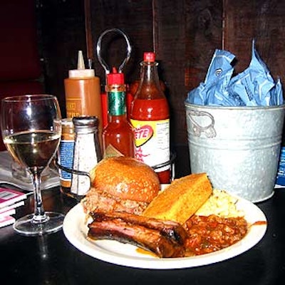 Guests at Gourmet magazine’s Super Sunday Bash at Blue Smoke filled their plates with baked beans, St. Louis spare ribs, pork sandwiches, and macaroni and cheese.