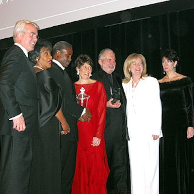 Award presenters and recipients lined up with MPA and ASME leaders after the ceremony: Dan Brewster, MPA chairman; Congresswoman Maxine Waters; Edward Lewis, Henry Johnson Fisher award recipient; Nina Link, MPA President and CEO; Art Cooper, Magazine Editors' Hall of Fame inductee; Susan Ungaro, ASME president; and Marlene Kahan, ASME executive director.