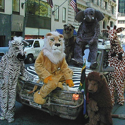 Wearing costumes from Happy Daze and Abracadabra Superstore, animal performers toured Manhattan in donated Land Rovers, specially decorated for the 'City Safari' theme by artist and designer Norval Johnson.