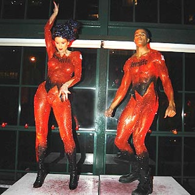 Peter Brown painted dancers in glittery red and black body paint. (Photo by Patrick McMullan Photography)
