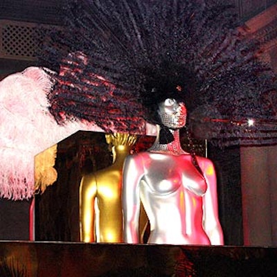 At the Young Fellows of the Frick Collection's benefit at the museum, silver mannequins with feather headdresses and silver appliques decorated gold platforms in the Garden Court.