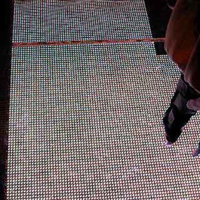 A clear glass runway sat on top of a long stretch of LCD lights that flashed and changed colors throughout the show.