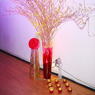 Bill Kocis of Bill Kocis Designs placed large arrangements of forsythia in tall vases filled with glittery gel around the room.