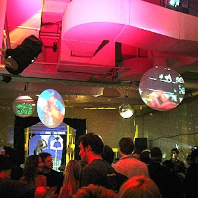Ultravision suspended round projection screens from ceiling.