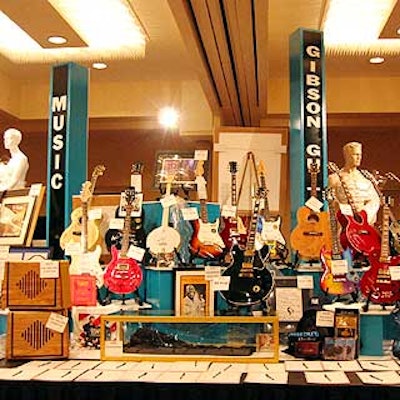 The silent auction area featured Gibson Guitars signed by various musicians.
