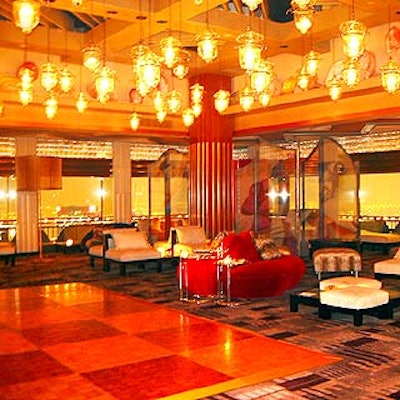 Preston Bailey suspended glass lanterns above the dance floor to give the Pavillion Room a relaxed, loungey environment.