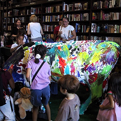 Children helped paint a fiberglass cow on the fourth floor of the Barnes & Noble store in Union Square.